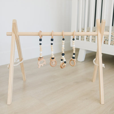Wooden Baby Gym + Black Toys