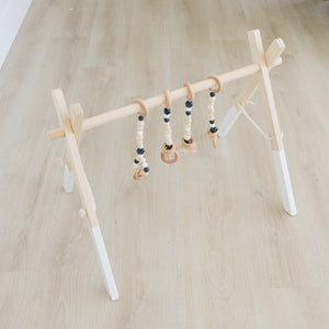 Wooden Baby Gym + Black Toys