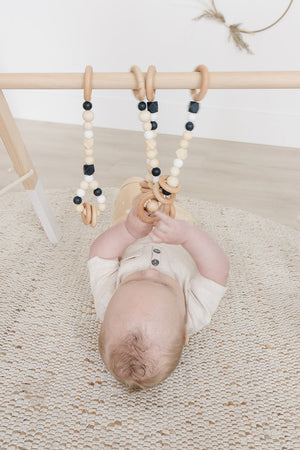 Wooden Baby Gym + Black Toys